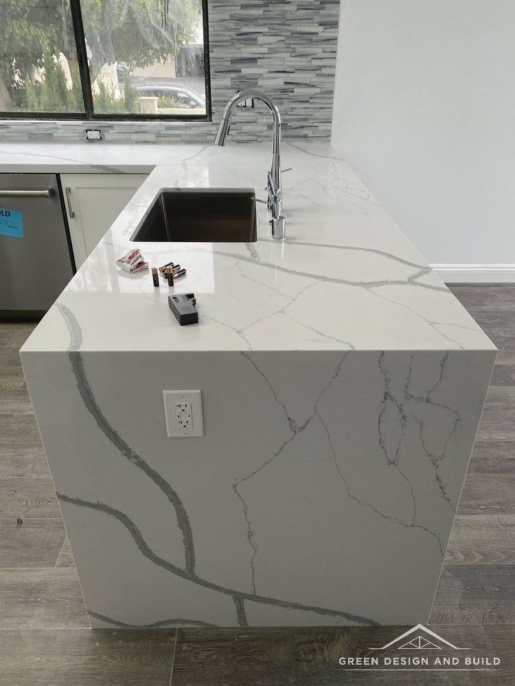 Mitred quartz waterfall edge on a kitchen island in a Burbank home