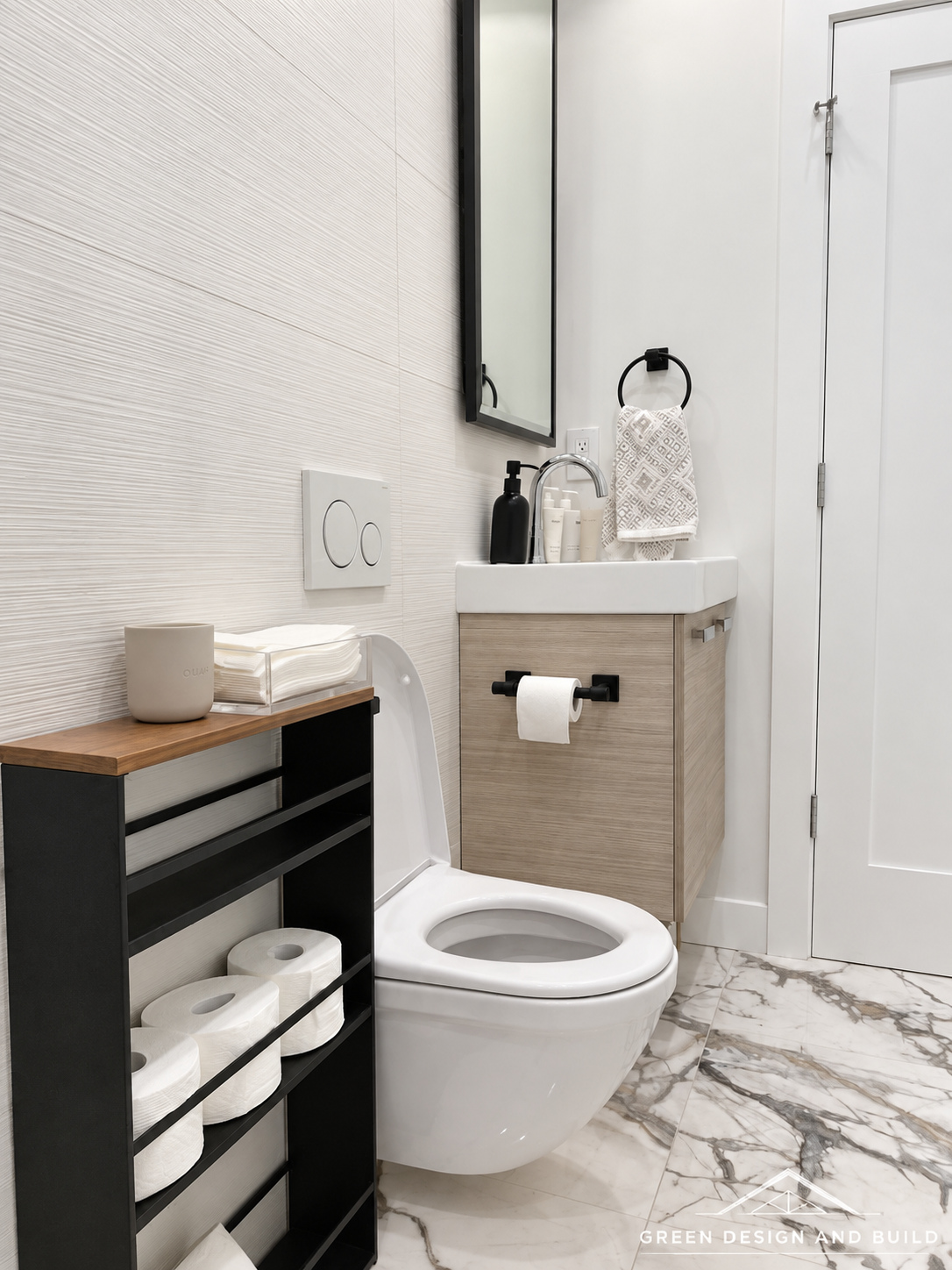 Compact bathroom with a wood-effect vanity, wall-hung toilet and large-format marble floor tile in Diamond Bar
