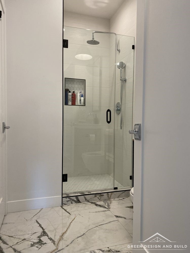 Frameless shower and large-format marble floor tile in a Diamond Bar bathroom remodel