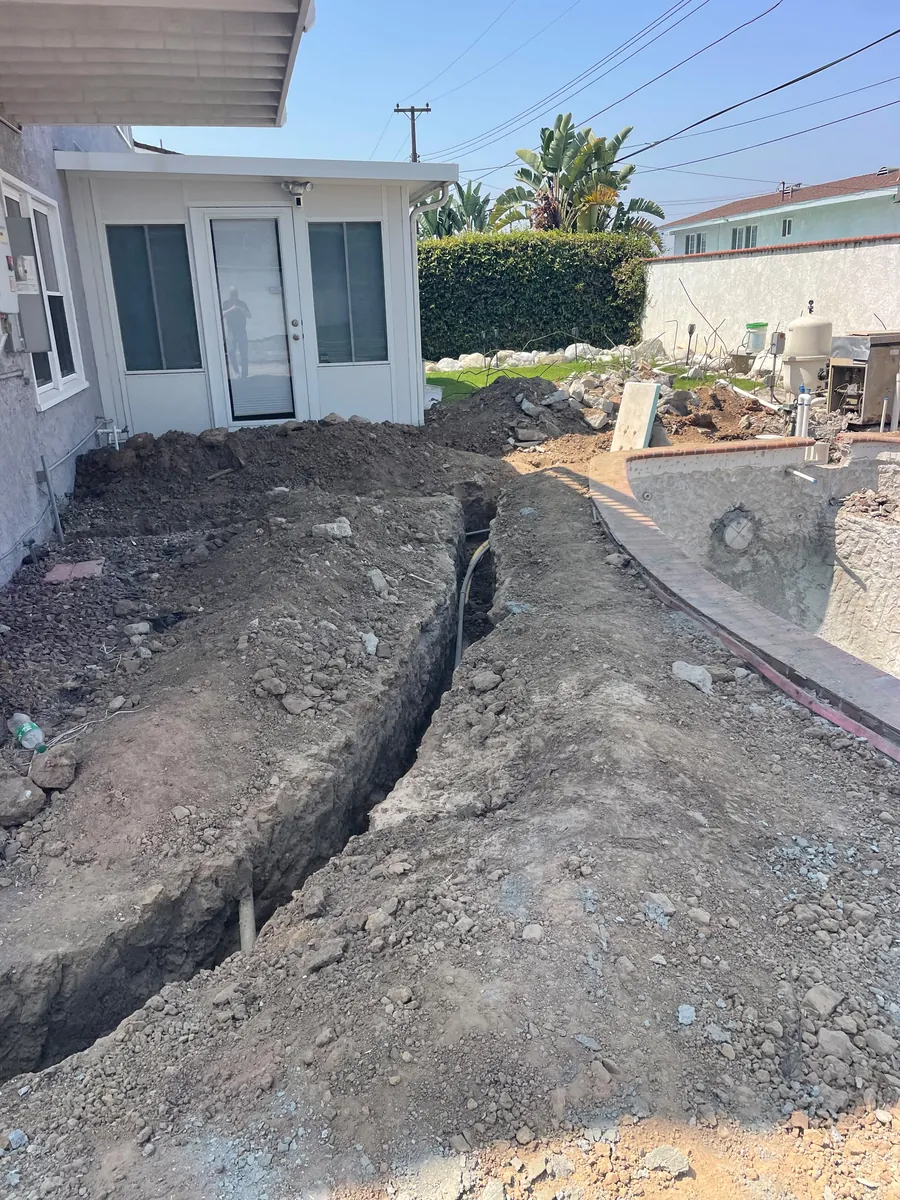 Rear yard during excavation, looking back toward the house