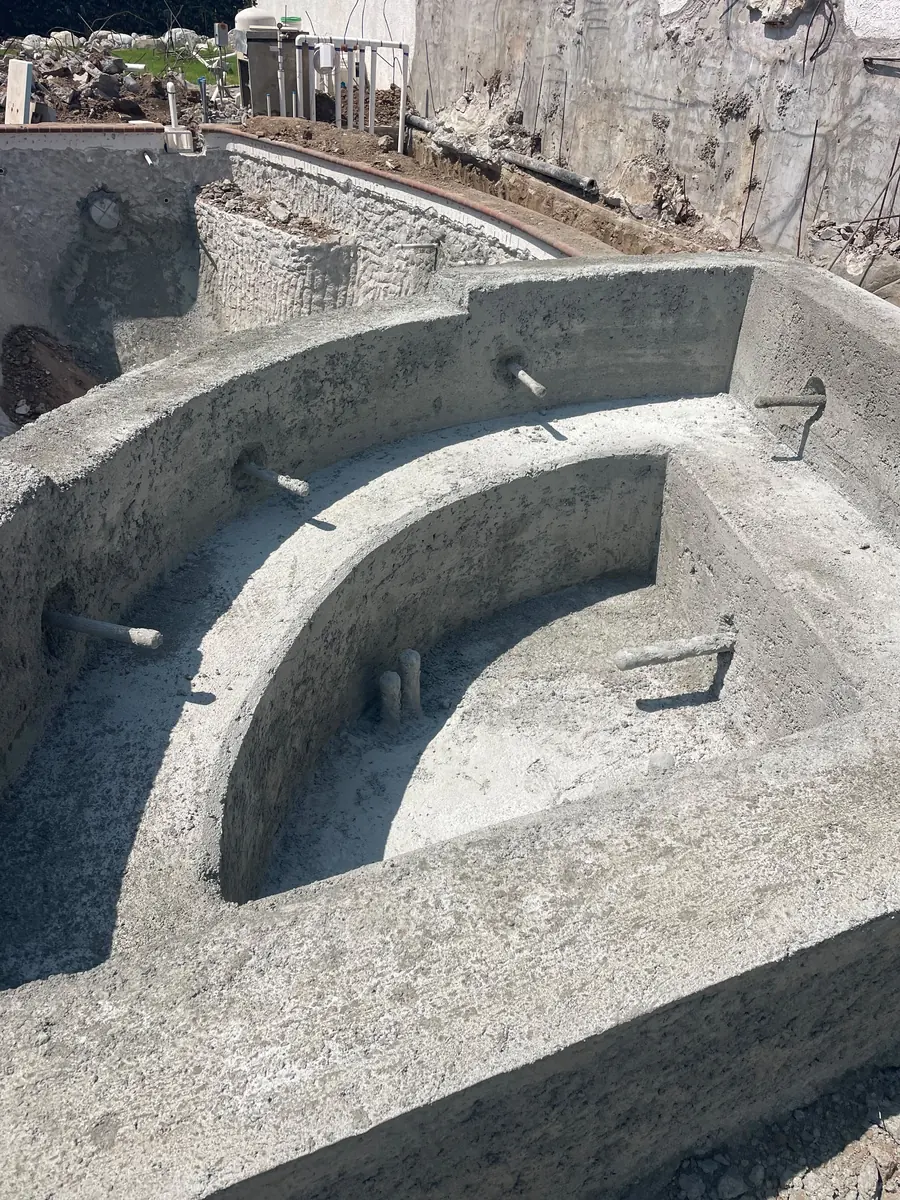 Inside the shotcrete shell before plaster, showing the step and bench forms
