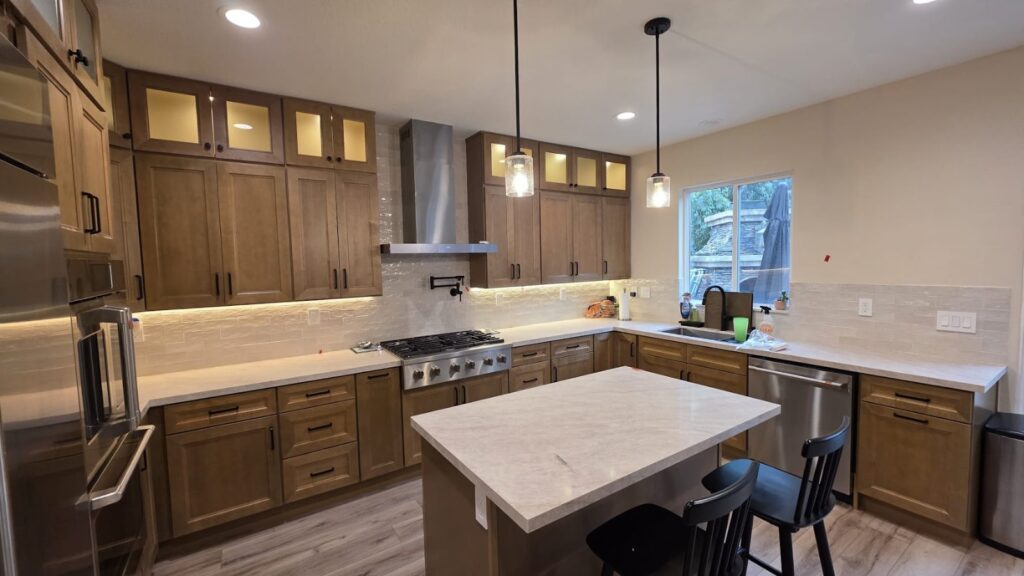 After: island and glass uppers — kitchen remodel in Calabasas, CA