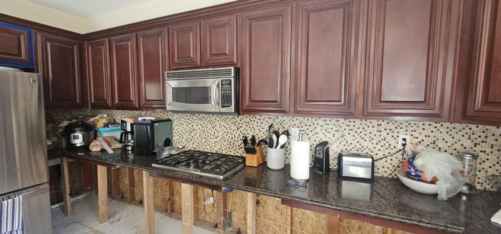 Before: cherry cabinets and mosaic backsplash — kitchen remodel in Calabasas, CA