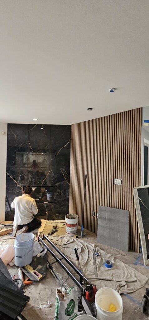 Fireplace wall with slat-wood feature — whole-home remodel in Encino, CA