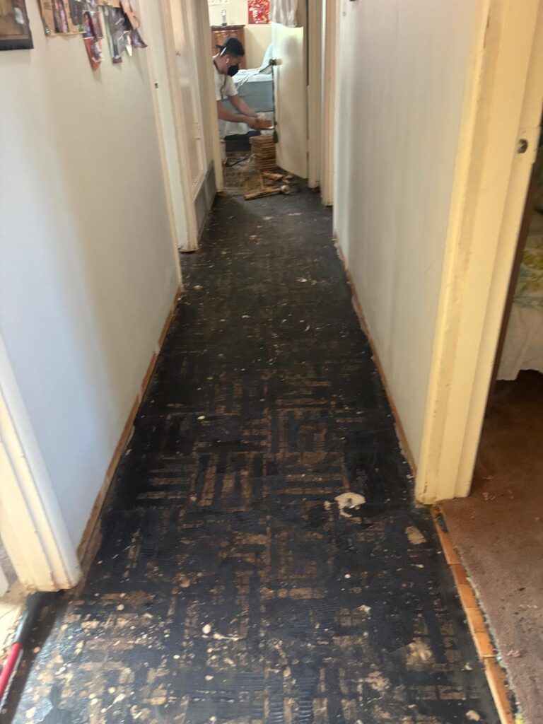 Before: old subfloor after carpet removal — flooring installation in Garden Grove, CA
