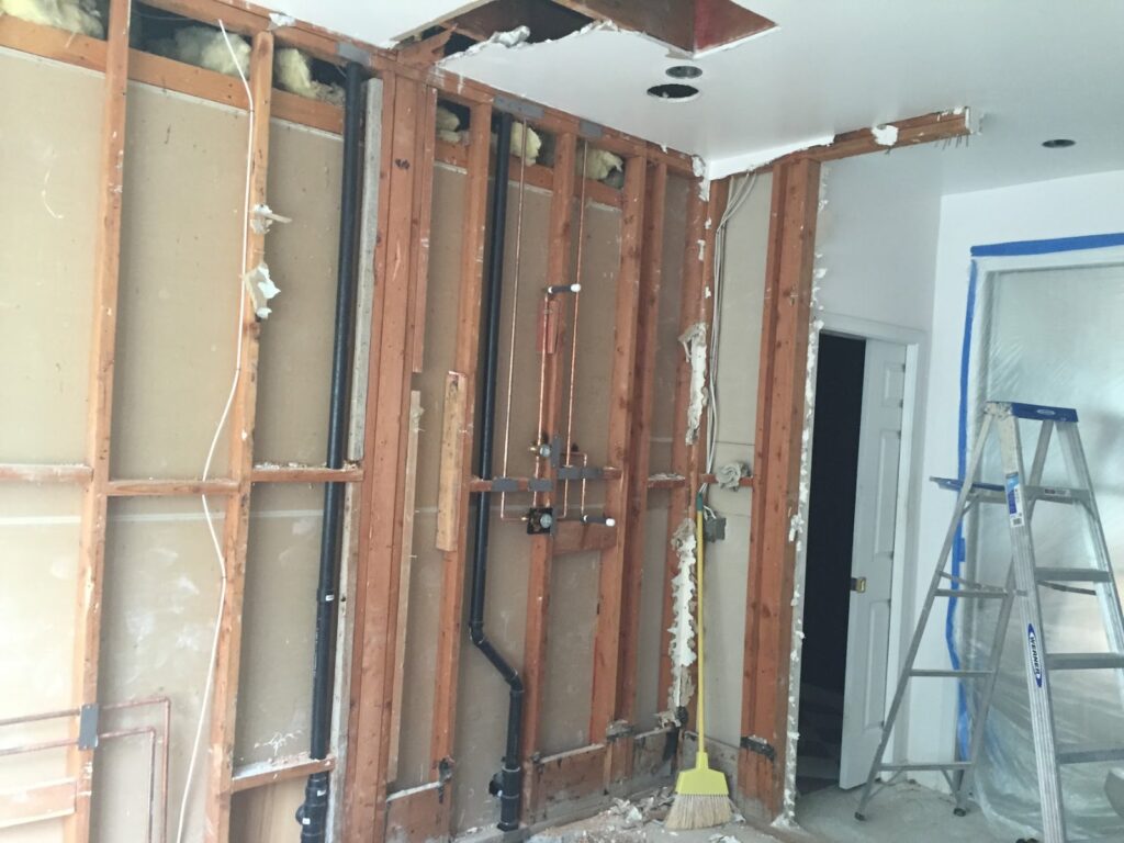 New copper supply lines and drain roughed in through open stud framing, Inglewood bathroom remodel