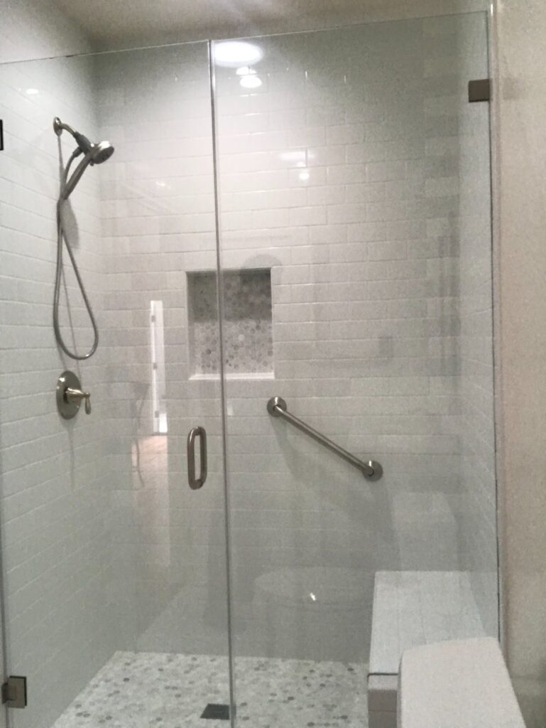Bathroom: tiled shower with niche — garage-to-ADU conversion in Los Angeles, CA