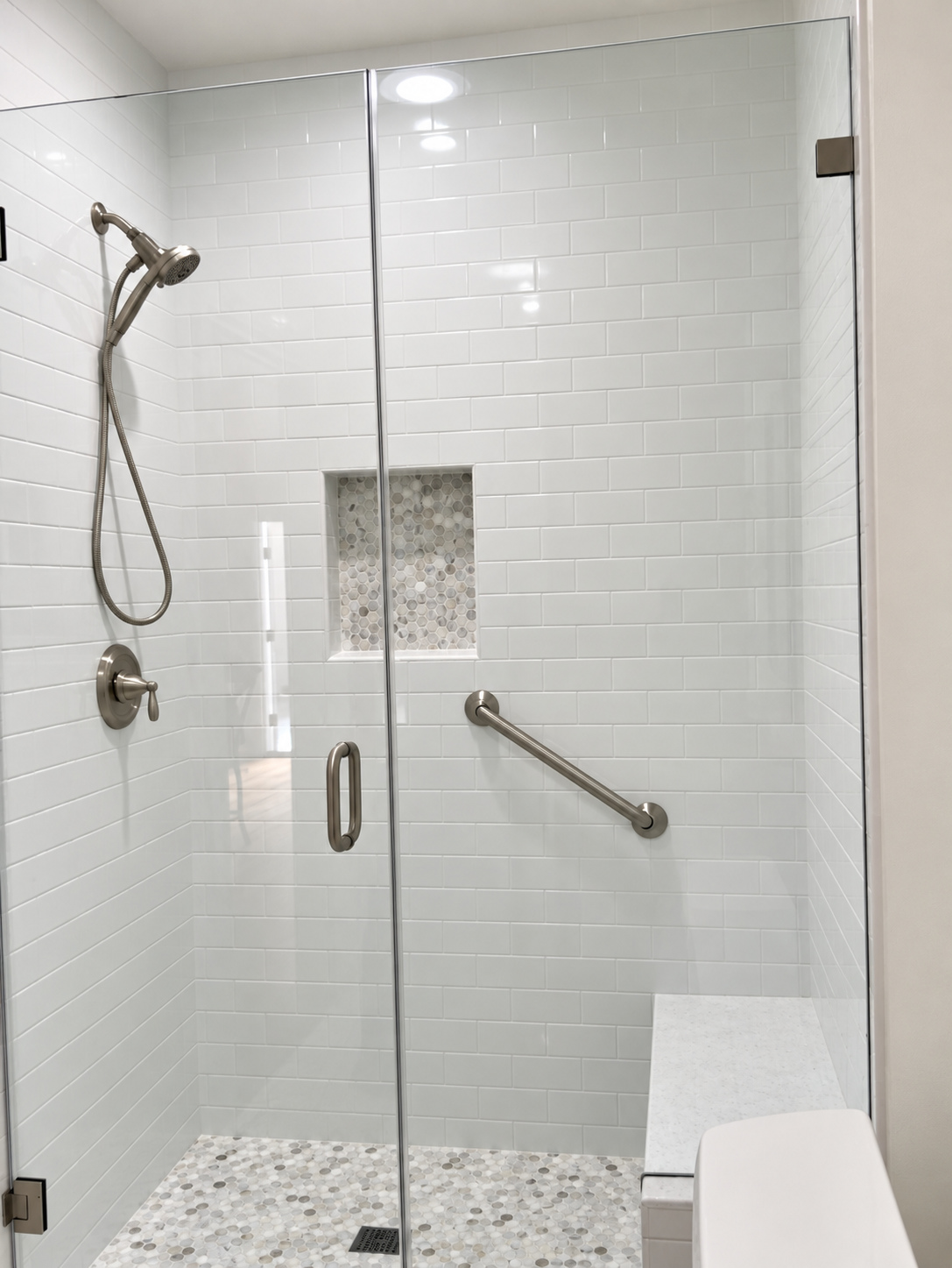 Bathroom: tiled shower with niche — garage-to-ADU conversion in Los Angeles, CA