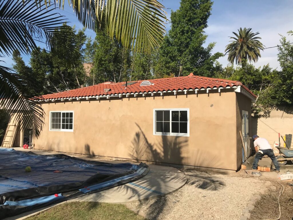 Exterior finished: stucco, tile roof, new windows — garage-to-ADU conversion in Los Angeles, CA