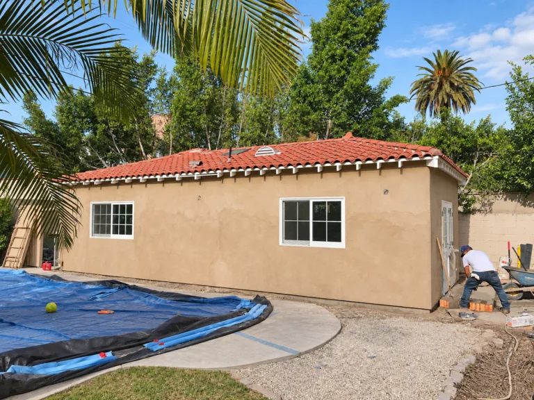 Exterior finished: stucco, tile roof, new windows — garage-to-ADU conversion in Los Angeles, CA