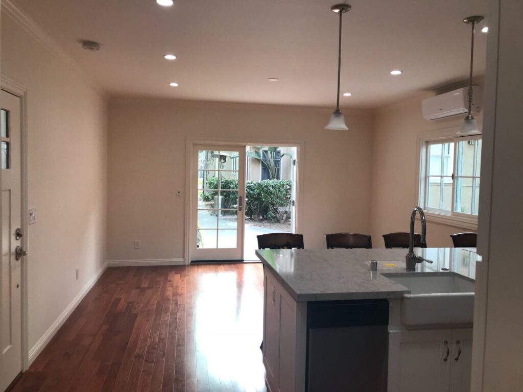 Inside: living area toward the French doors — garage-to-ADU conversion in Los Angeles, CA