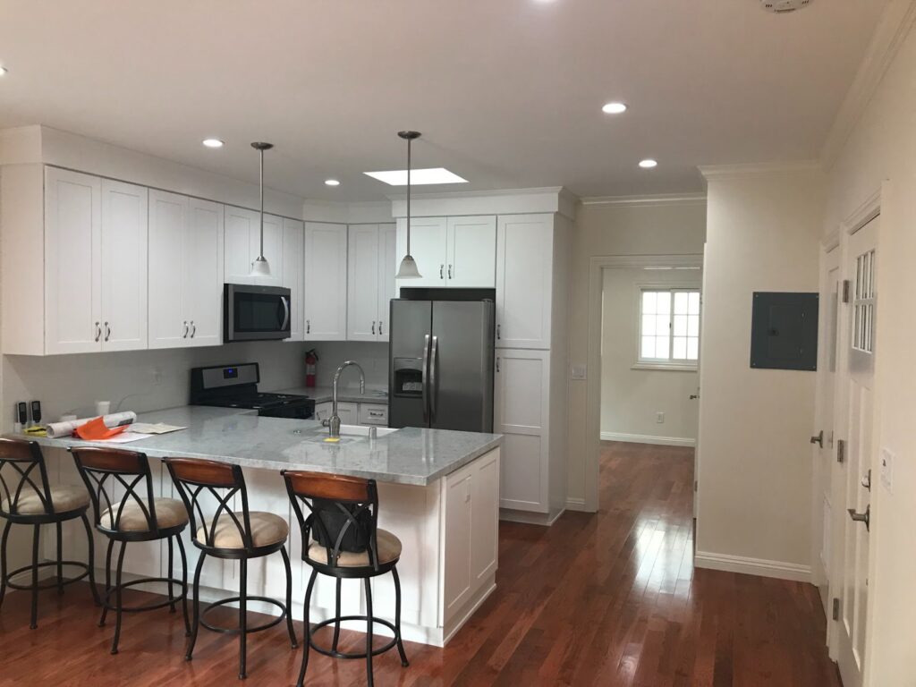 Kitchen with island and full appliances — garage-to-ADU conversion in Los Angeles, CA