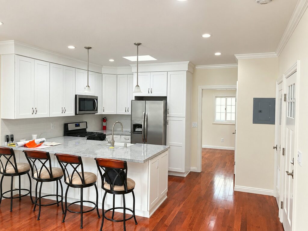 Kitchen with island and full appliances inside the converted garage ADU