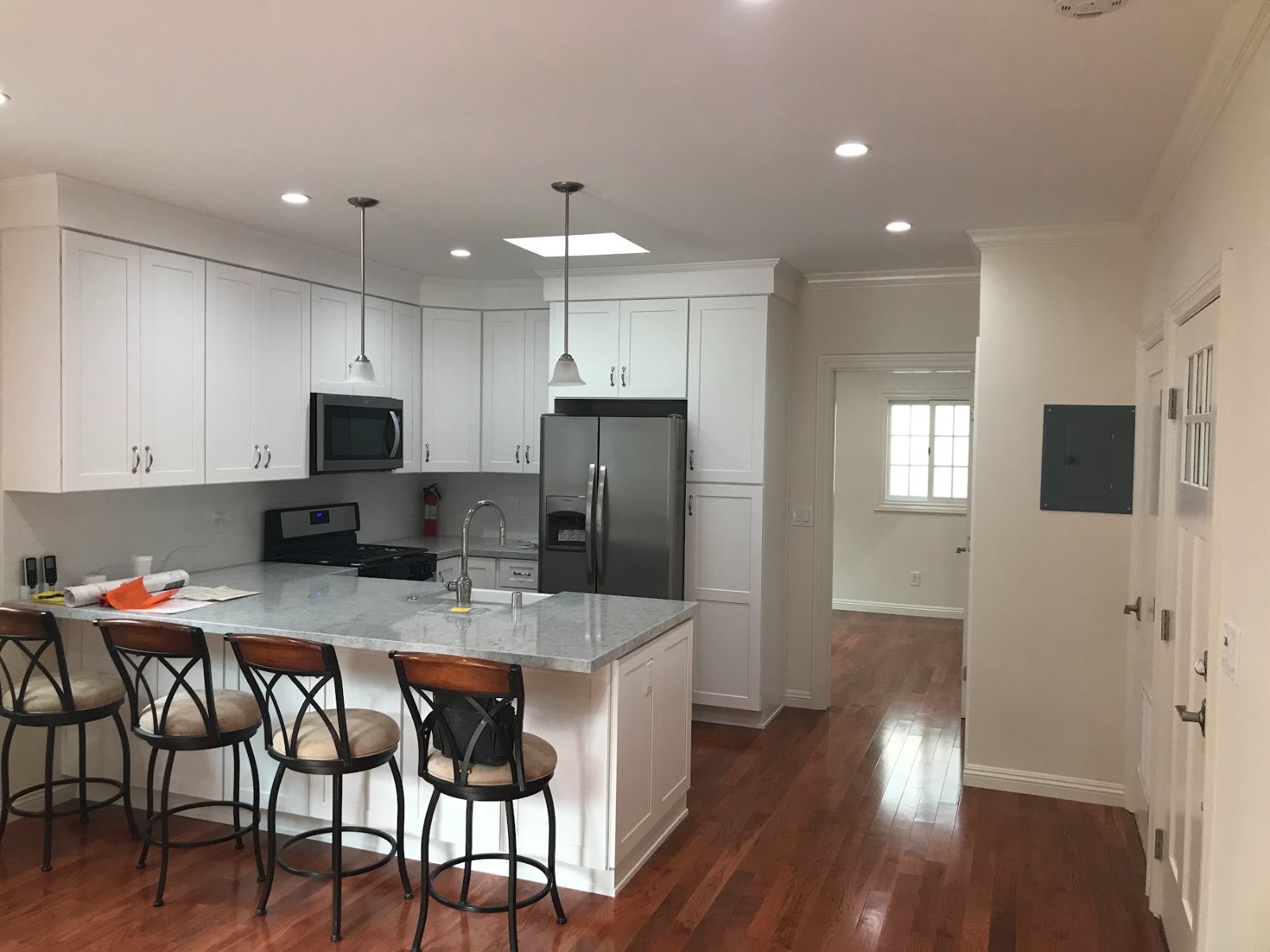Full kitchen with island and appliances inside a converted garage ADU in Los Angeles