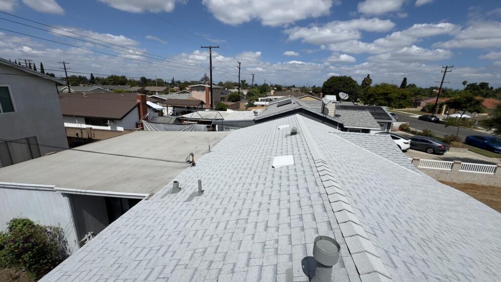 After: roof and chimney — roof replacement in Newport Beach, CA