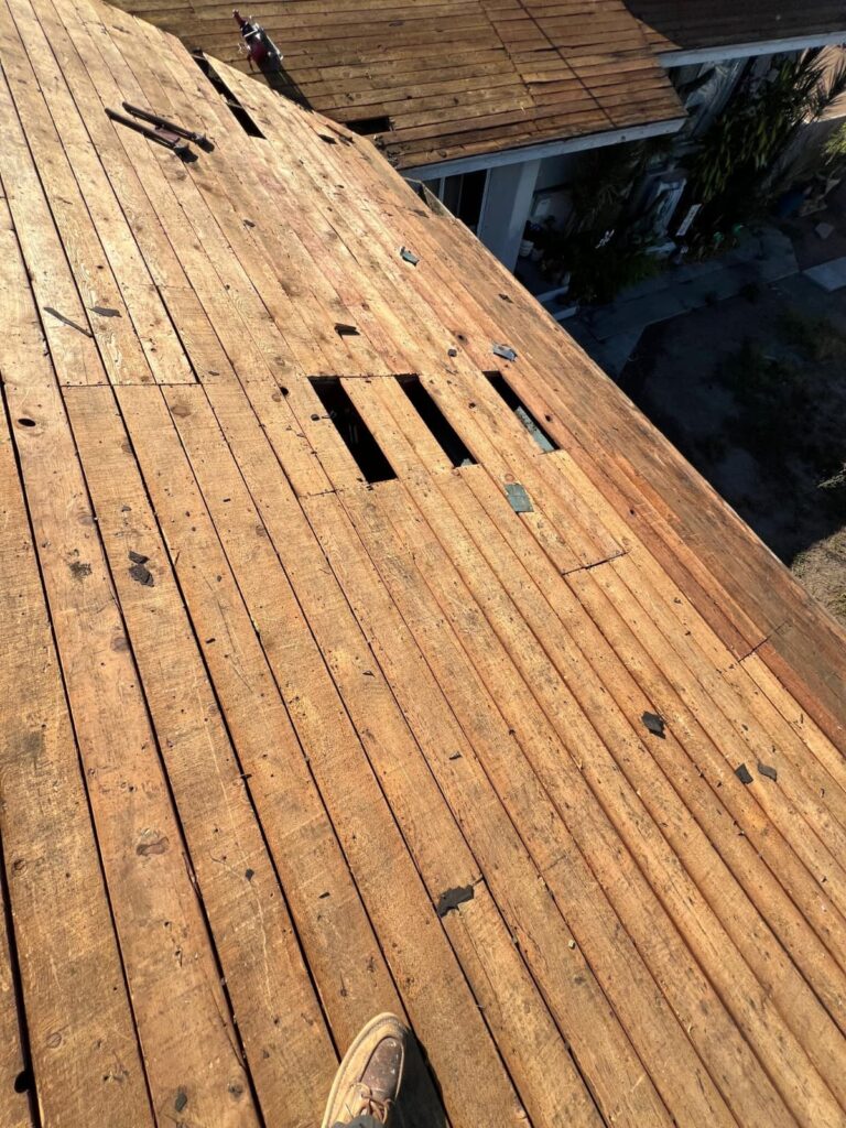 Stripped deck with holes — roof replacement in Newport Beach, CA