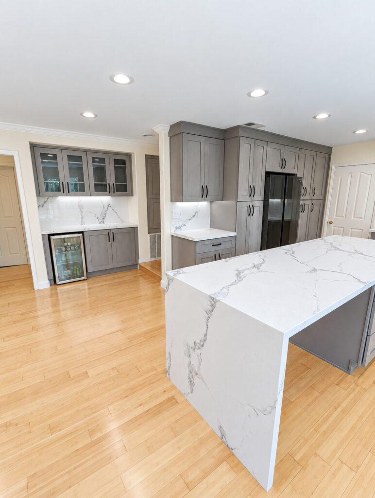 Quartz waterfall island in a remodeled kitchen in Sherman Oaks