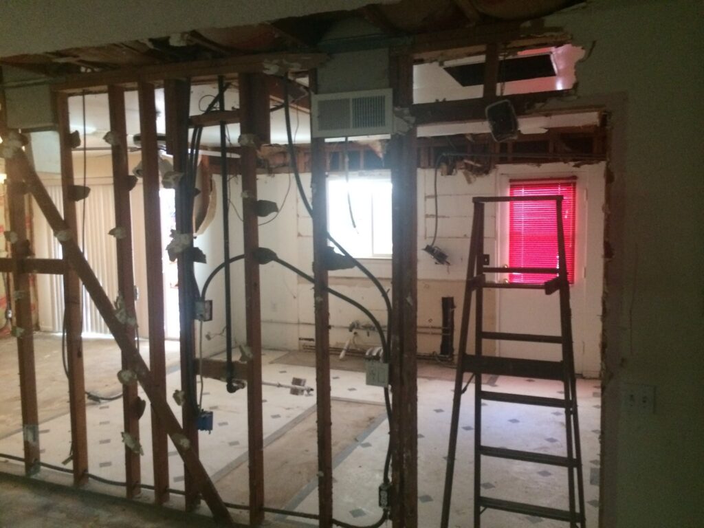 New framing with the beam pocket and rough electrical after a load-bearing wall was removed, Torrance kitchen remodel