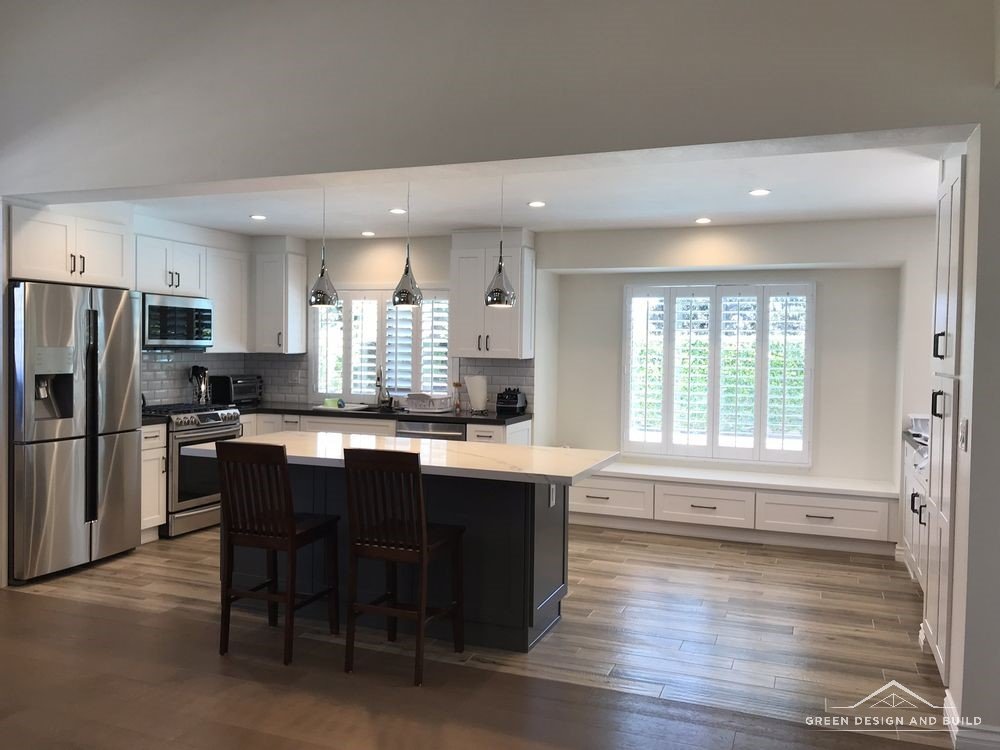 Open-plan kitchen and living space in a Manhattan Beach home after the dividing wall was removed