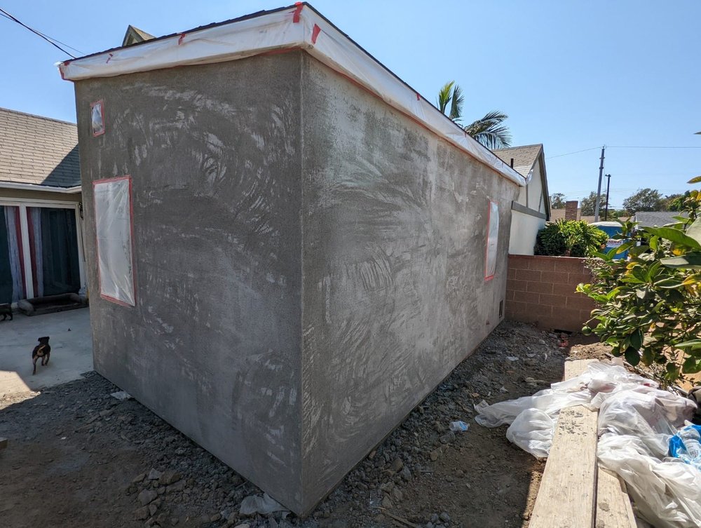 Scratch coat of stucco applied to the exterior of a new room addition in Montebello