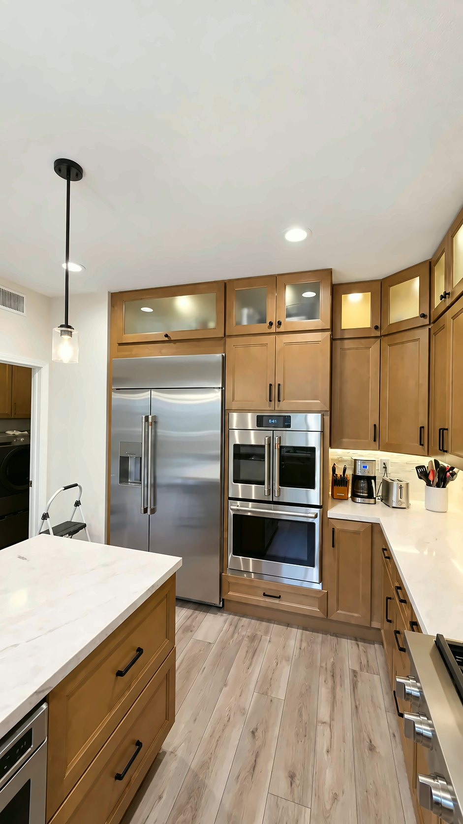 Built-in refrigerator beside a double wall oven &mdash; kitchen remodel in Pasadena, CA
