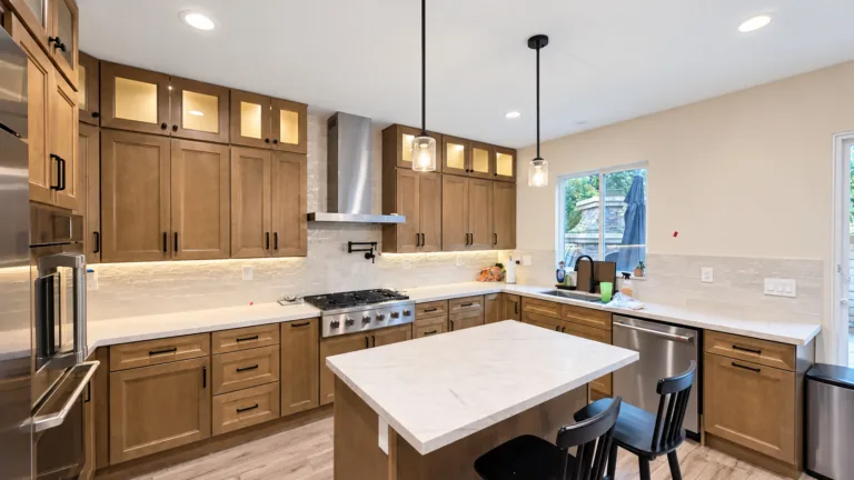 Range wall with pot filler and stainless hood in a Pasadena kitchen remodel