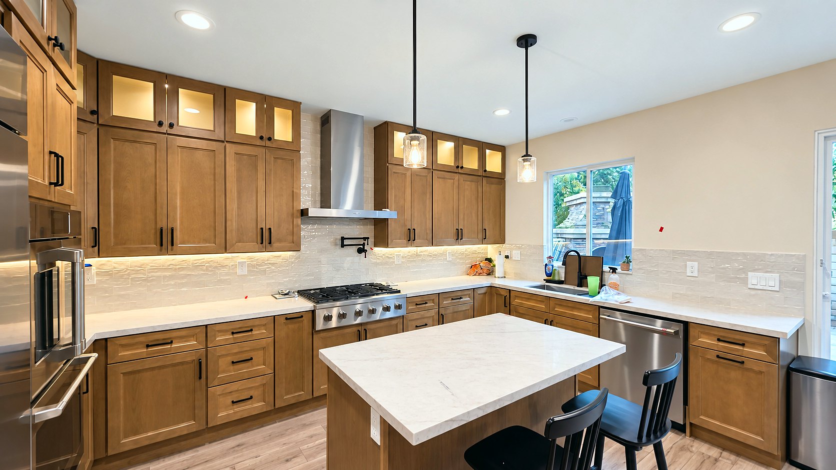Range wall with pot filler and stainless hood &mdash; kitchen remodel in Pasadena, CA