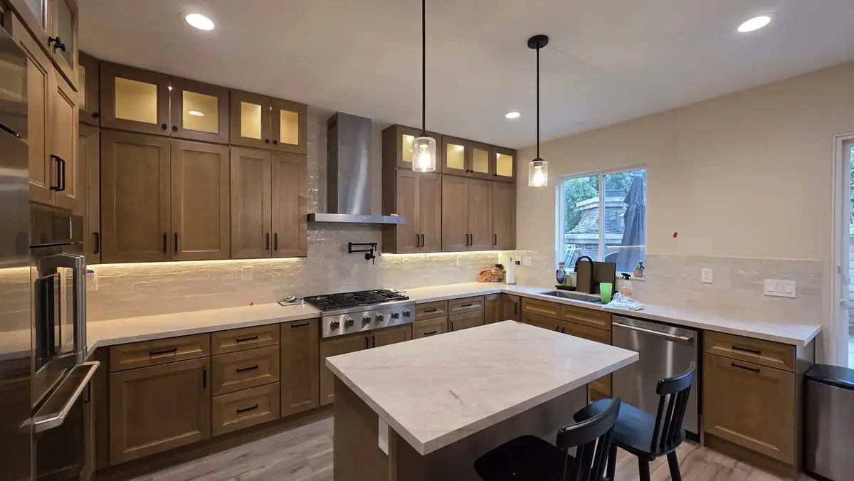Range wall with pot filler and stainless hood &mdash; kitchen remodel in Pasadena, CA