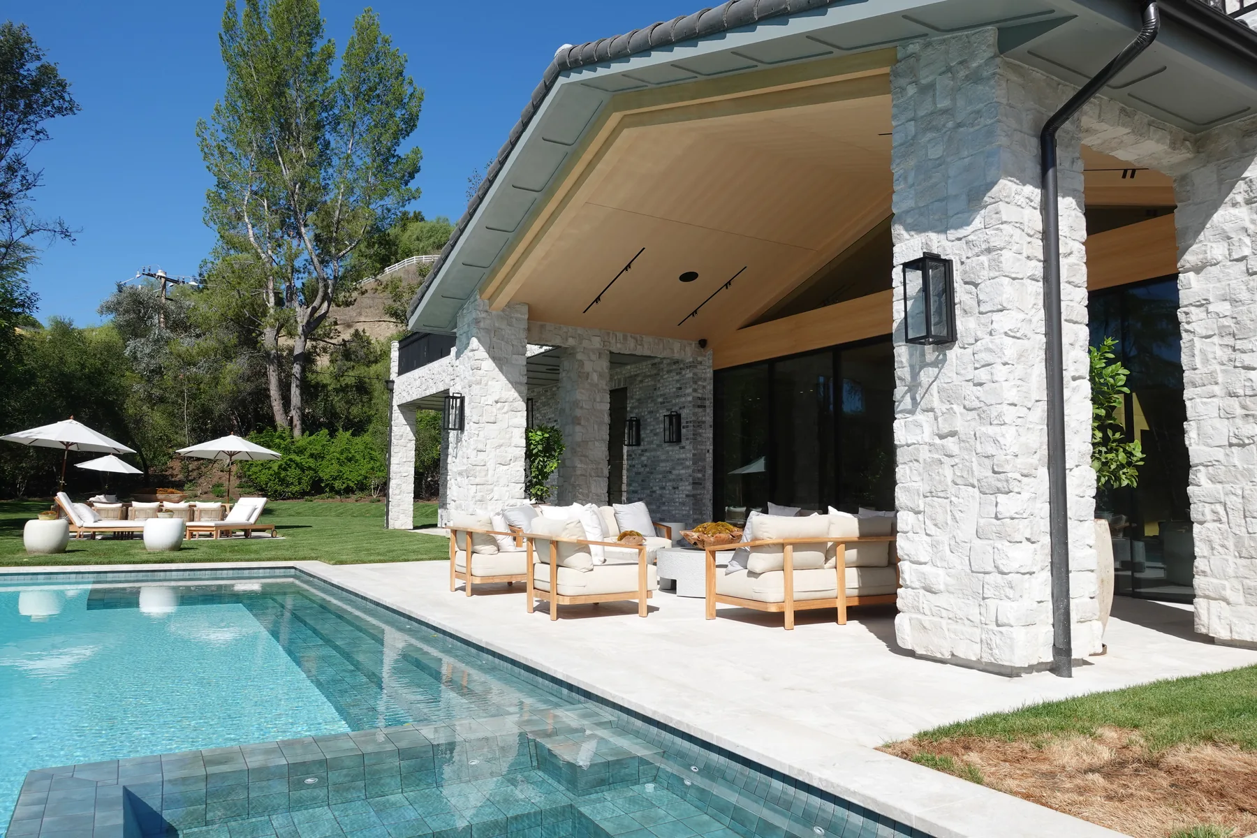 Covered patio alongside the pool on a Hidden Hills project