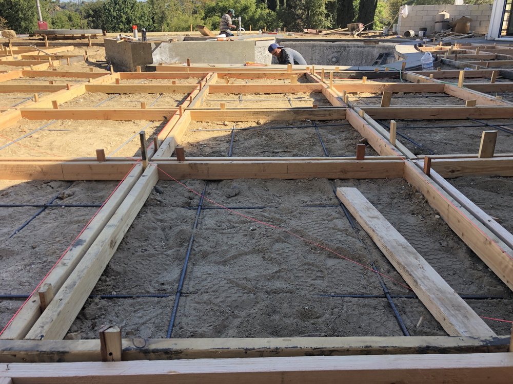 New foundation forms and reinforcing steel laid out on a Woodland Hills rebuild before the pour